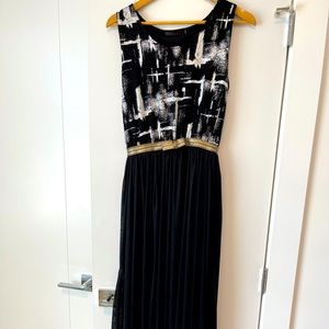 Black maxi dress. Pattern detail on top. Stretch fit. Size US 8